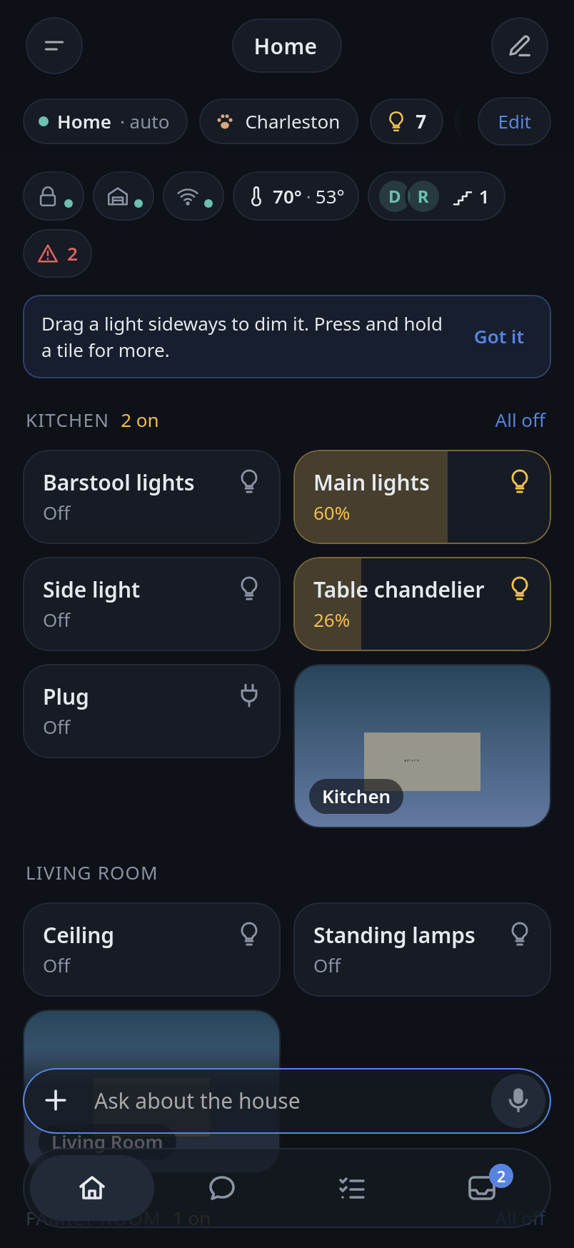 The Home screen: the rooms, the lights that are on, the cameras